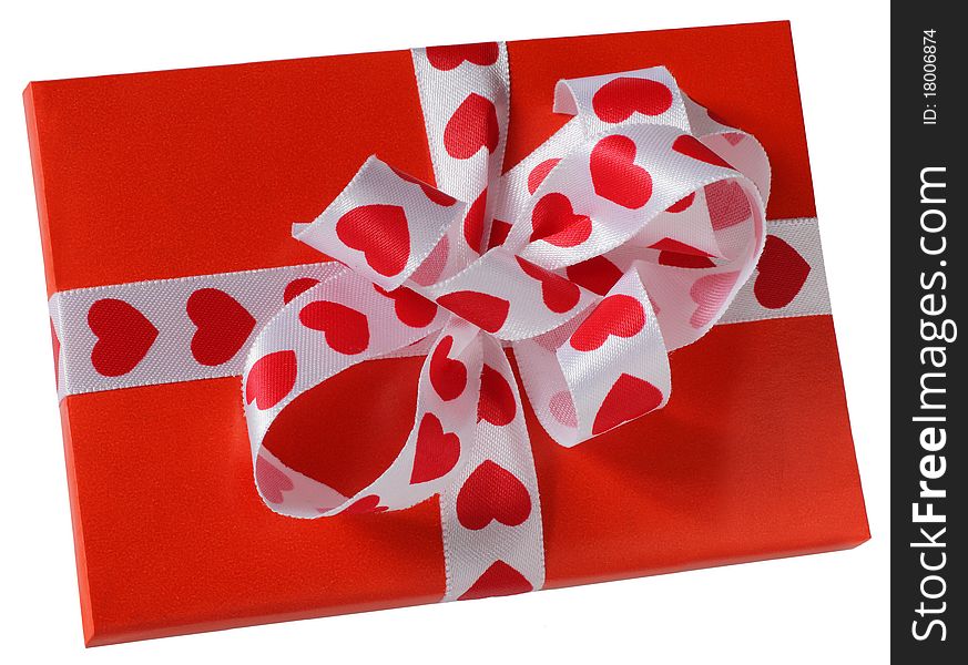Red parcel with hearts ribbon isolated in white. Red parcel with hearts ribbon isolated in white