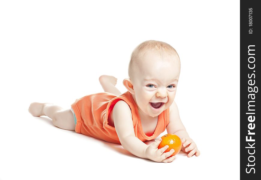 Small beautiful baby boy with mandarin on a white background