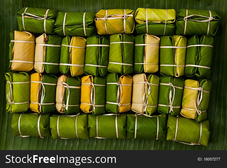 Thai style dessert,made from banana and glutionous rice wrap with banana leaf