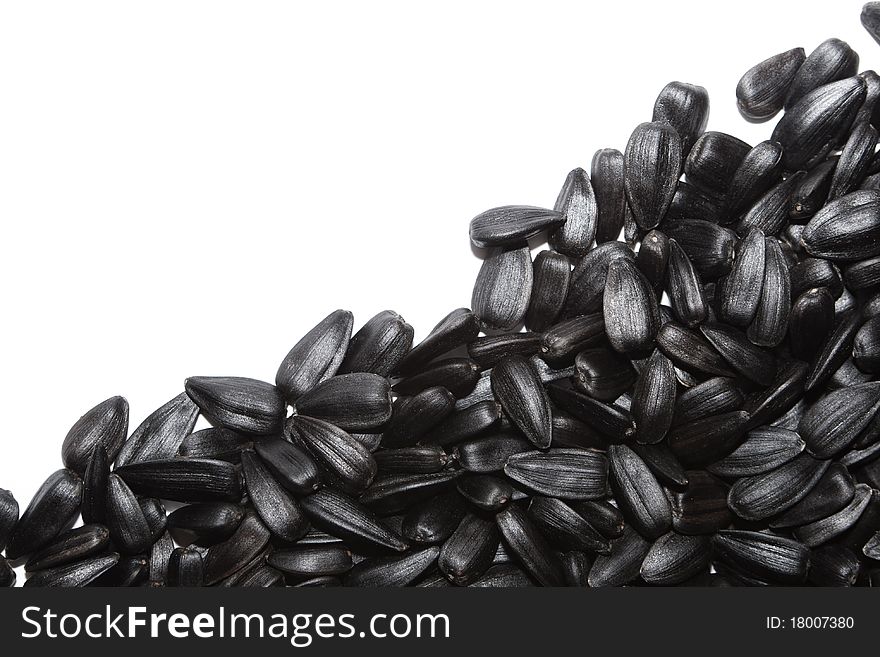 The big black seeds on white background