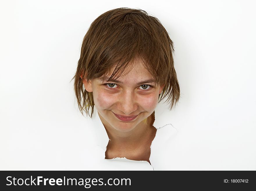 Young Woman is looking out of cutted paper.