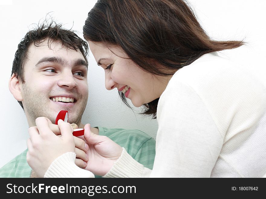 Man asking a woman to marry him isolated in white background. Man asking a woman to marry him isolated in white background