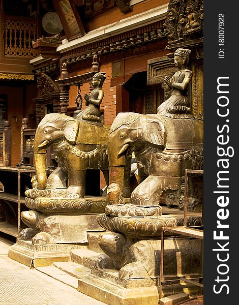 Figures in the beautiful golden temple in patan, nepal