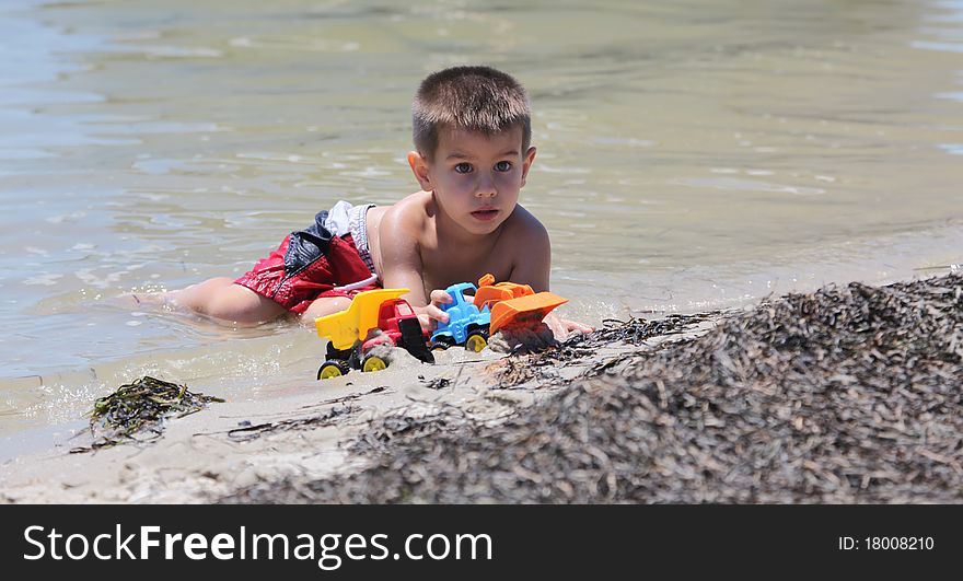 A boy playing at the beach. A boy playing at the beach