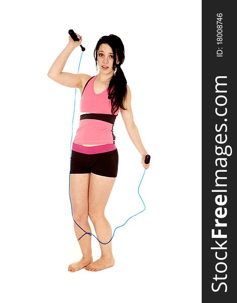 A woman is tripping on a jump rope. A woman is tripping on a jump rope.