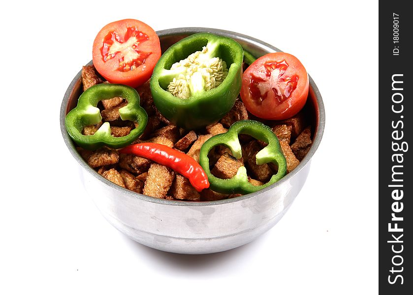 Bowl of fried potatoes and vegetables isolated on white background. Bowl of fried potatoes and vegetables isolated on white background.