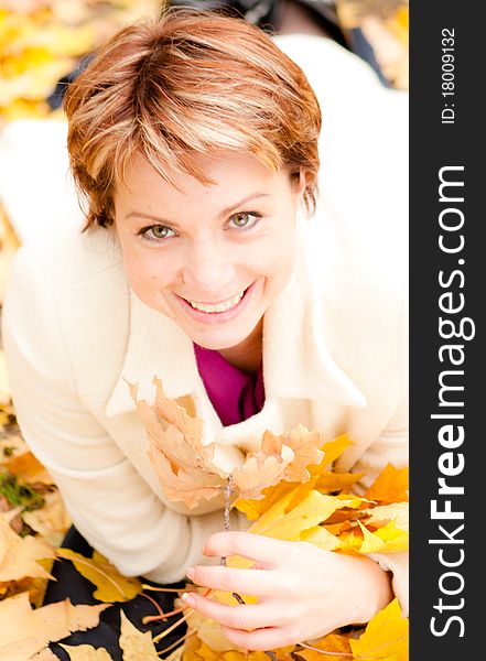 Charming  Woman In An Autumn Park