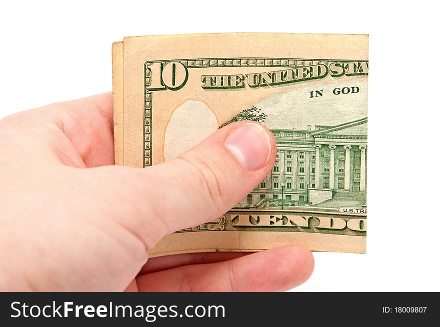 Hand holds a 10 dollar bill on white background