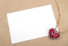 Blank Greeting Card And Heart In Wire Cage Stock Photography