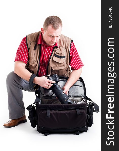 Photographer with digital kamera and zoom lens on white background