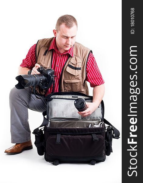 Photographer with digital kamera and zoom lens on white background