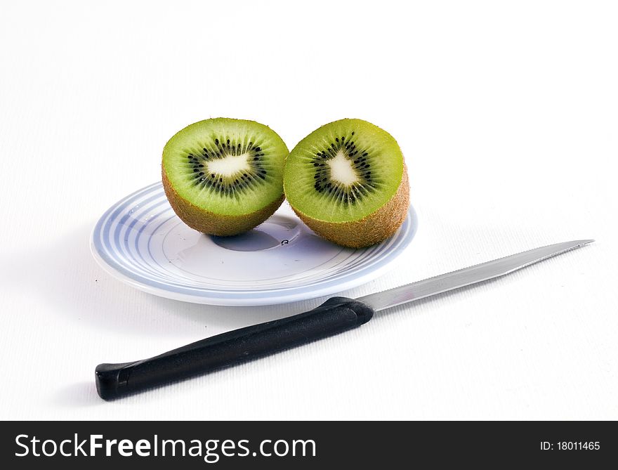 Kiwi on the plate with knife