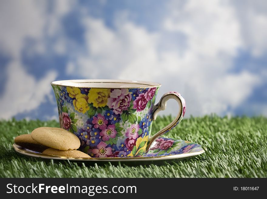 Coffee and cookies outside on grass. Coffee and cookies outside on grass