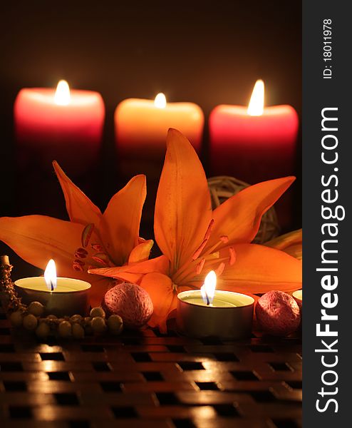 Orange Lilies scene by candlelight. Orange Lilies scene by candlelight.