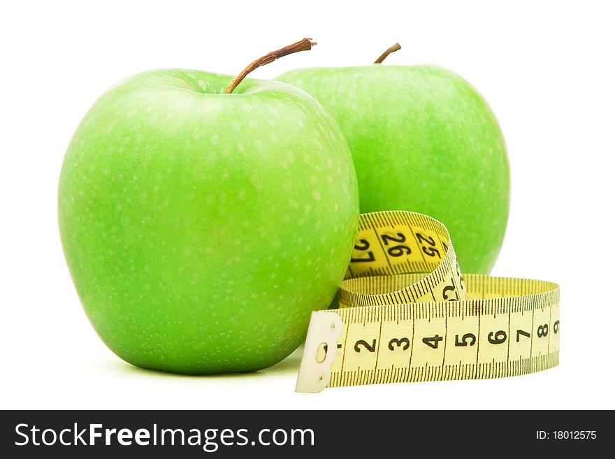 Green apple with centimeter isolated over white background. Green apple with centimeter isolated over white background