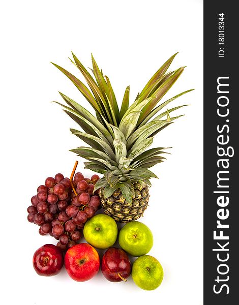 Grape, pineapple, red apple and green apple shoot from top view over isolated white background. Grape, pineapple, red apple and green apple shoot from top view over isolated white background.