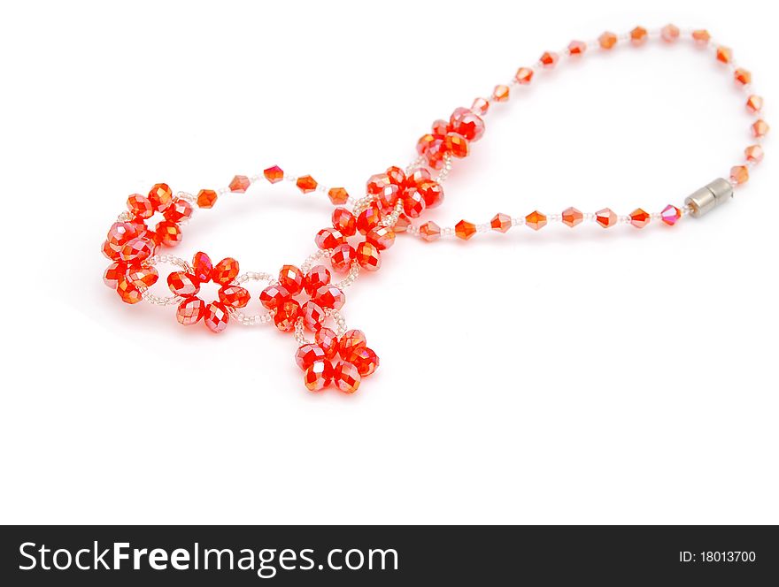 Beautiful red string of beads isolated on white background
