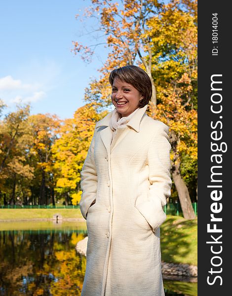 Charming young woman in an autumn park