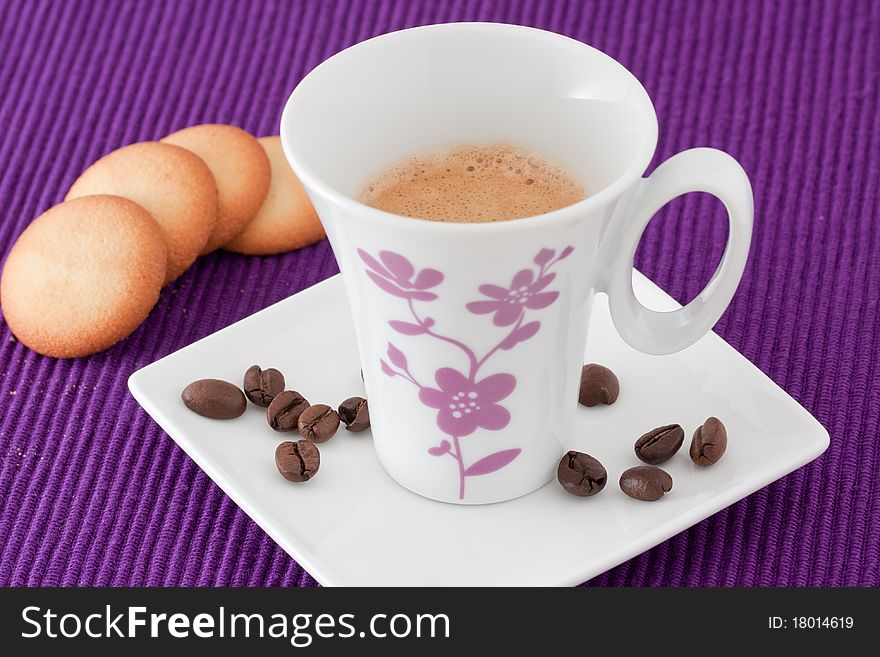 An elegant cup of coffee with biscuits. An elegant cup of coffee with biscuits