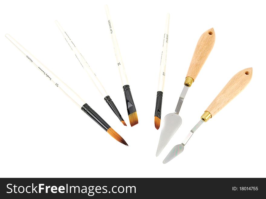 Painter tools with some brushes and special knife isolated on the white background. Painter tools with some brushes and special knife isolated on the white background.