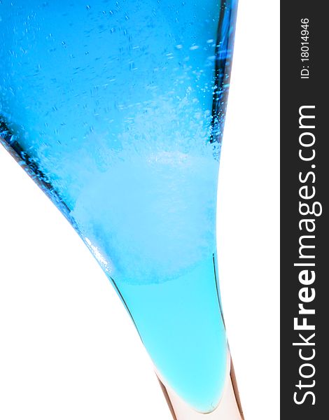 An effervescent tablet in a blue liquid. An effervescent tablet in a blue liquid.
