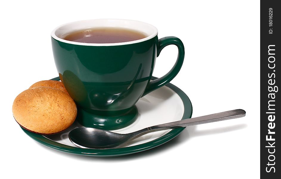 Cup of tea and biscuit isolated on white background