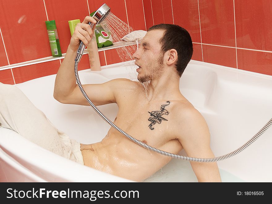 Drunken man in the tub wearing underpants