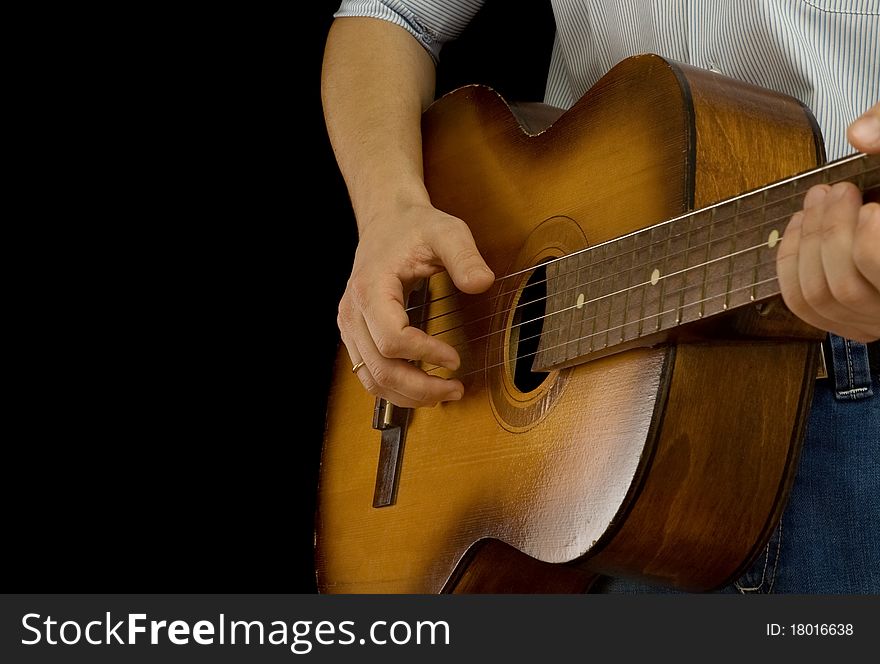 Guitar and man on black background