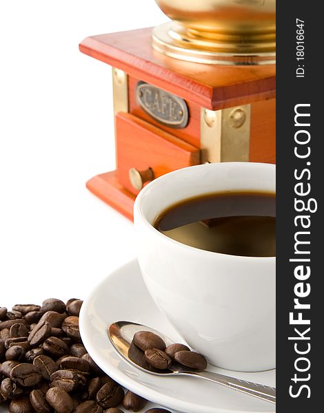 Grinder And Cup Of Coffee On Beans On White