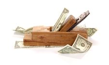 Work And Earn. Old Wood The Planer And Banknotes Royalty Free Stock Photography Work And Earn. Old Wood The Planer And Banknotes Royalty Free Stock Photography