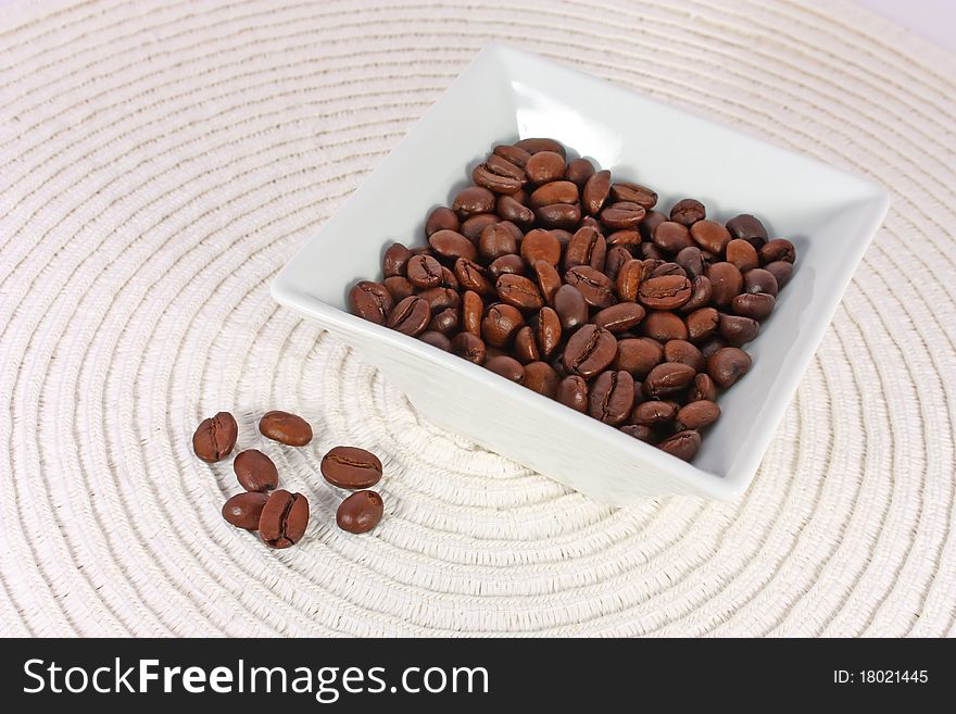 Roasted coffee beans in bowl