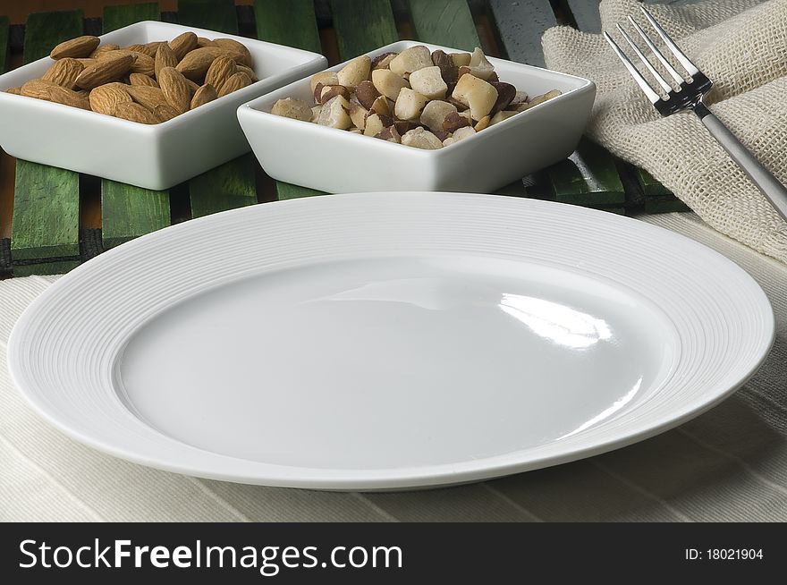 Empty white plate with decoration of olives and bread. Empty white plate with decoration of olives and bread