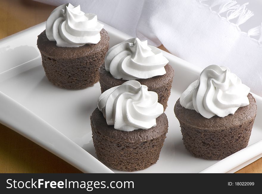 Muffins in decorated white plate