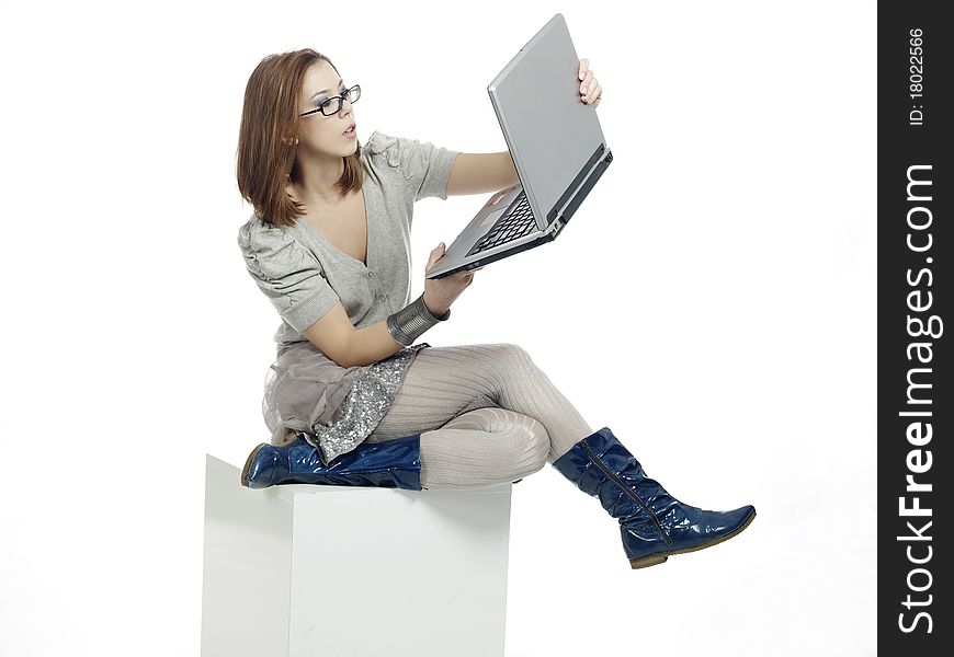 Young woman looking at her laptop monitor. Young woman looking at her laptop monitor