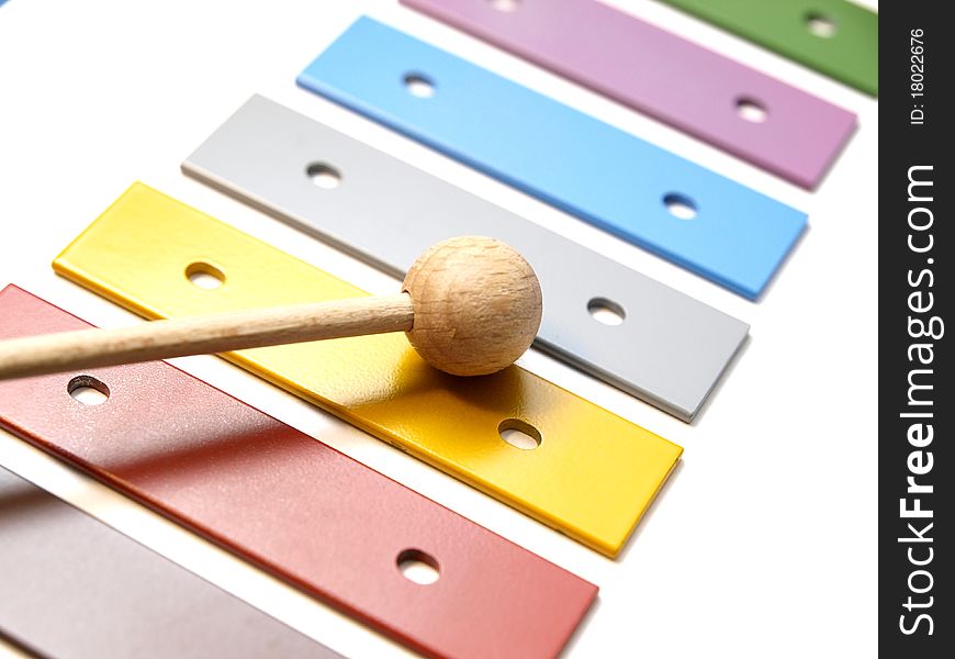 A colourful glockenspiel on white background