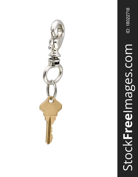 A golden key with a key ring on white background. A golden key with a key ring on white background