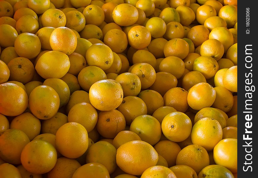 Fresh juicy oranges after the in the market supermarket wallpaper background. Fresh juicy oranges after the in the market supermarket wallpaper background