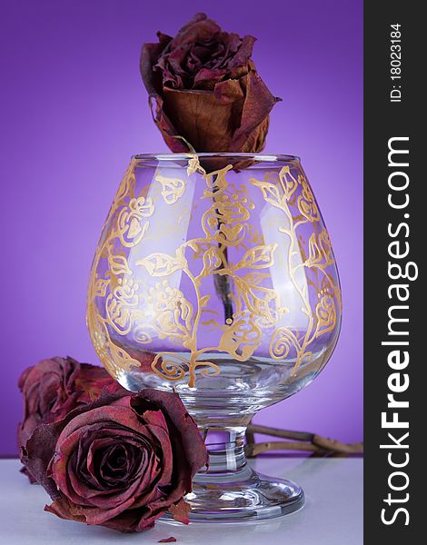 Design glass decorated in gold on purple background. Design glass decorated in gold on purple background
