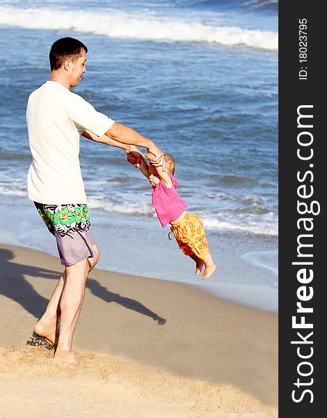 Dad with baby on the shore of the sea. Dad with baby on the shore of the sea