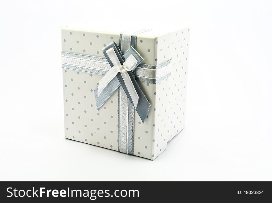 Gift box with ribbon and bow on the white background