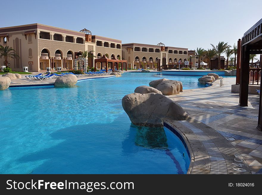 Blue pool with rocks in a seaside resort