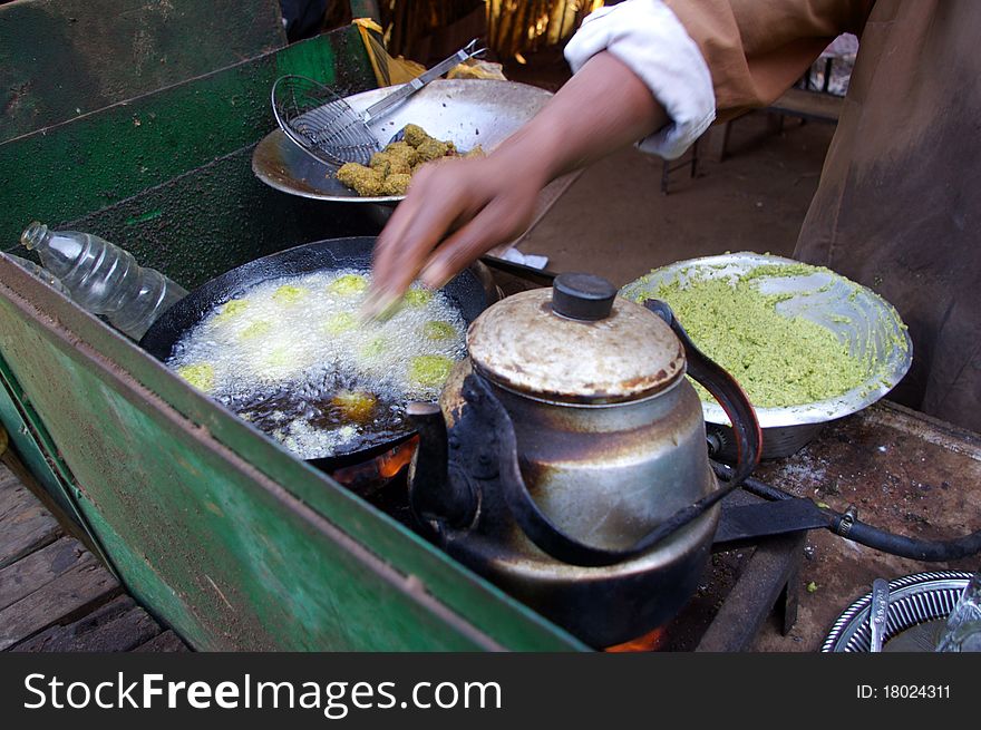 Fresh fritters of chickpeas food being prepared at roadside street restaurant in a egyptian village