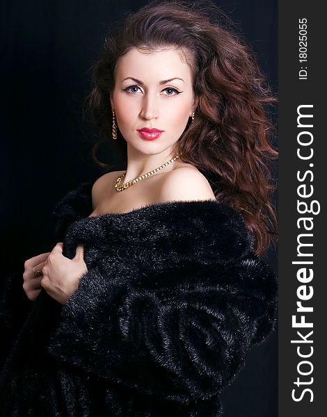 Beautiful woman in a black fur