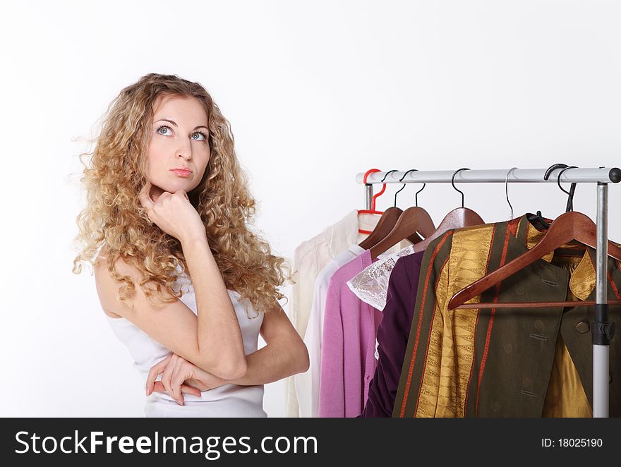 Portrait of a  girl selecting clothes in shop