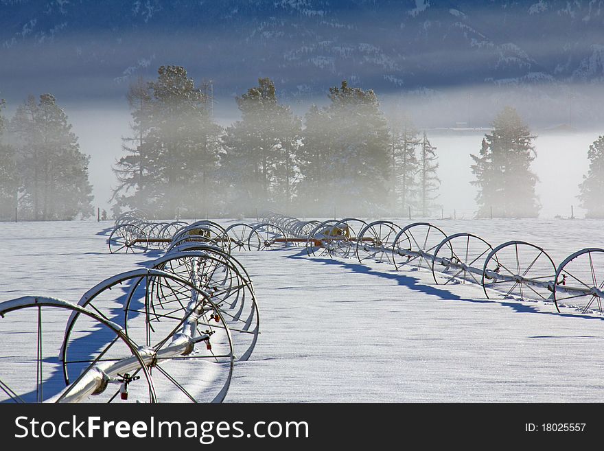 This image of the fog layers with the irrigation pipes in the foreground was taken in NW Montana. This image of the fog layers with the irrigation pipes in the foreground was taken in NW Montana.