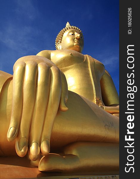 Big golden buddha with blue sky, Ang Thong province, Thailand. Big golden buddha with blue sky, Ang Thong province, Thailand.