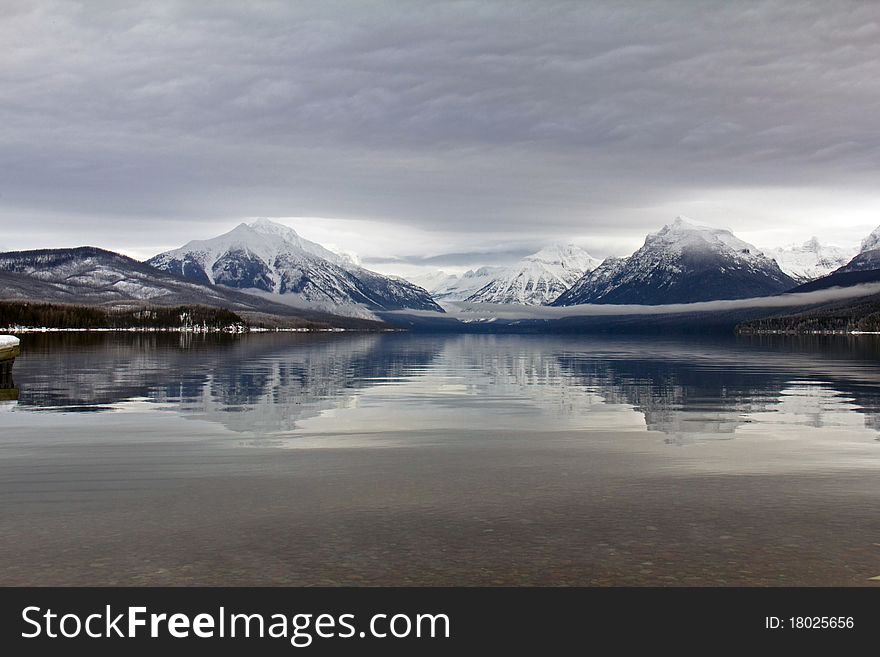 This image of the lake reflection was taken on a gray, snowy, cold day in NW Montana.
