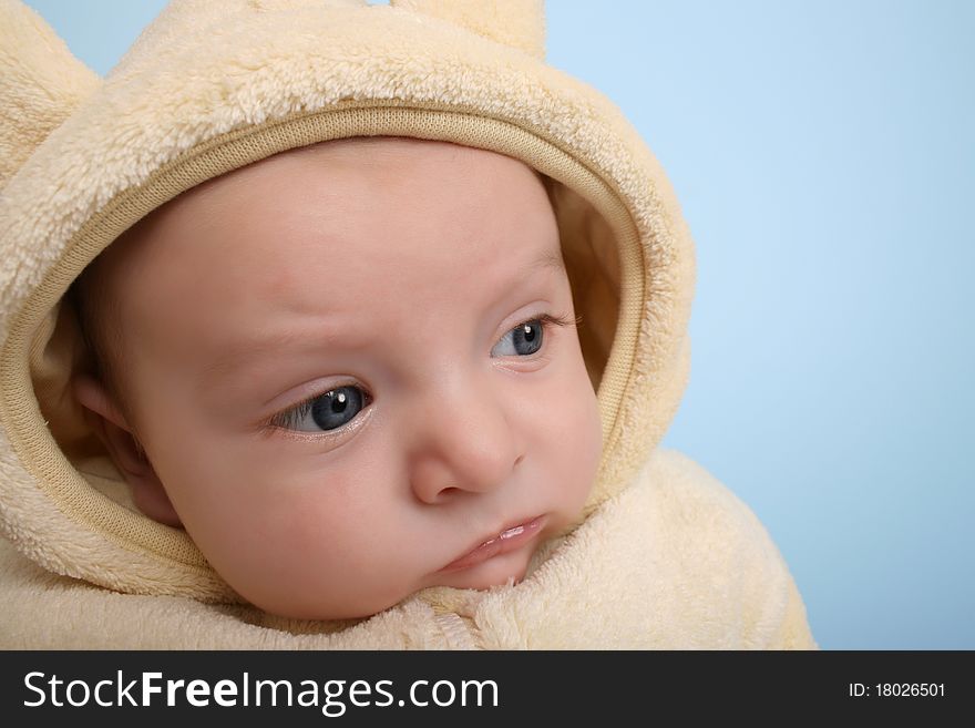 Two month old baby boy wearing a soft animal suit