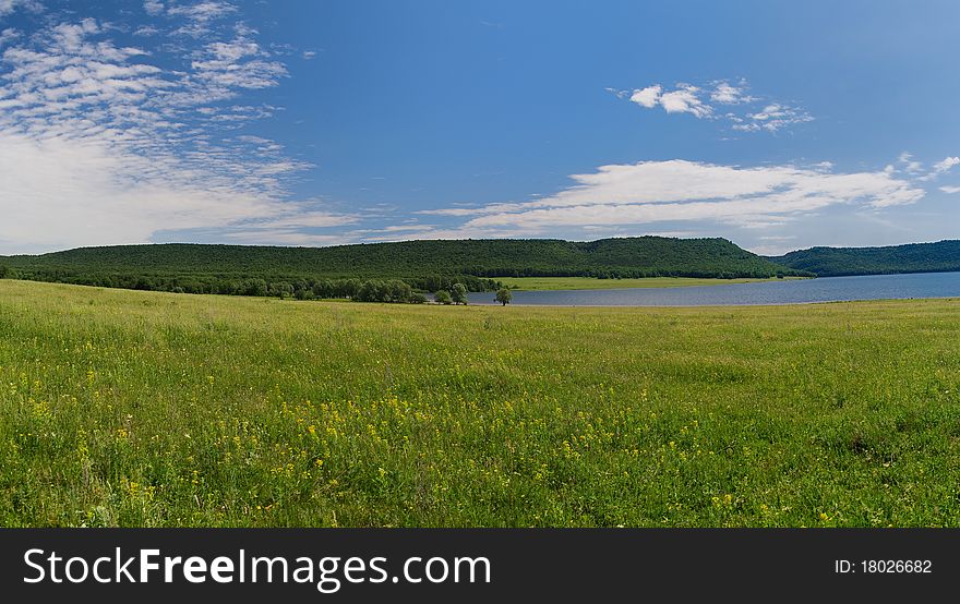 Lake Nugush, Bashkortostan, Russia, Privolnaya field, june, sunny lake, over kuperlya waterfall. Lake Nugush, Bashkortostan, Russia, Privolnaya field, june, sunny lake, over kuperlya waterfall