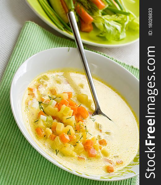 Vegetable soup with carrot, cabbage and potatoes in bowl